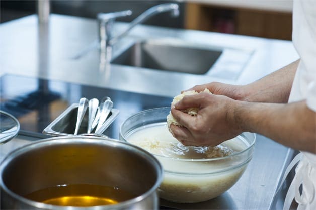 Soaking rice being put into the pot