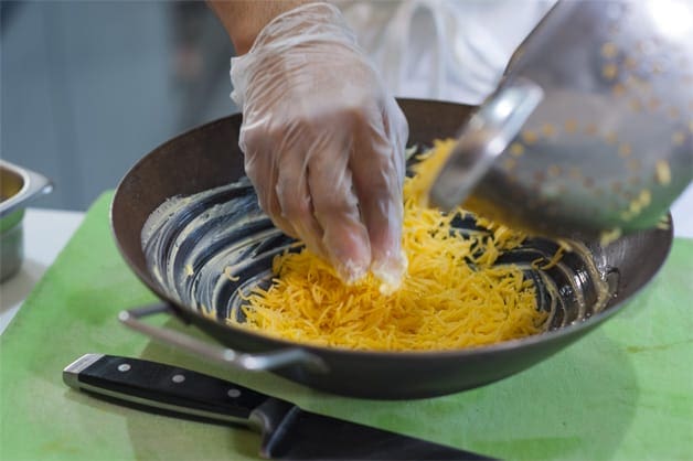 Cooked rice being dished into a bowl